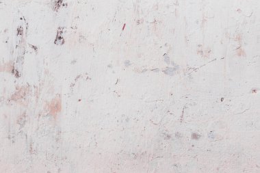 Çatlakları ve çizikleri olan beton bir duvarın dokusu arka plan olarak kullanılabilir.