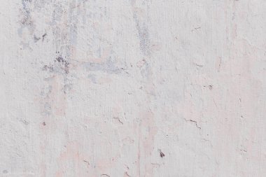 Çatlakları ve çizikleri olan beton bir duvarın dokusu arka plan olarak kullanılabilir.