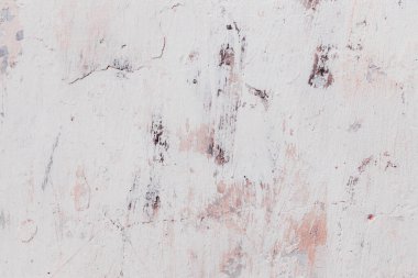 Çatlakları ve çizikleri olan eski beton duvarın dokusu arka plan olarak kullanılabilir.