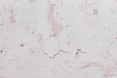 Çatlak beton duvarın çatlaklardan ve çiziklerden oluşan dokusu arka plan olarak kullanılabilir.
