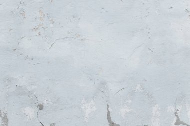 Çatlakları ve çizikleri olan eski beton duvarın dokusu arka plan olarak kullanılabilir.