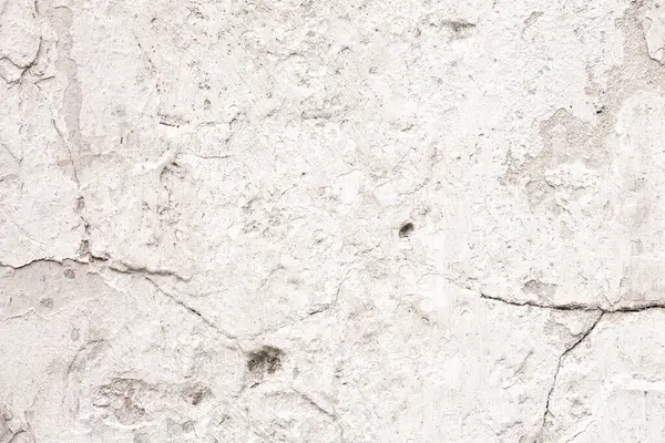 Çatlakları ve çizikleri olan beton bir duvarın dokusu arka plan olarak kullanılabilir.