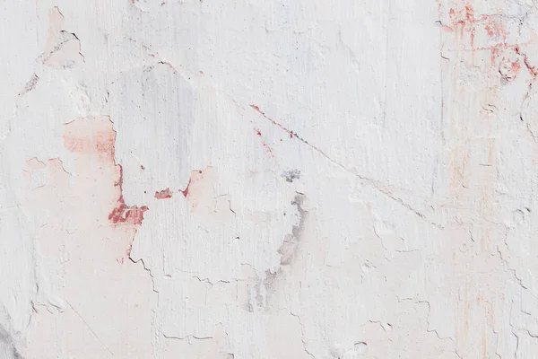 Çatlakları ve çizikleri olan eski beton duvarın dokusu arka plan olarak kullanılabilir.