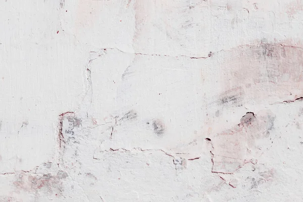 Çatlakları ve çizikleri olan eski beton duvarın dokusu arka plan olarak kullanılabilir.