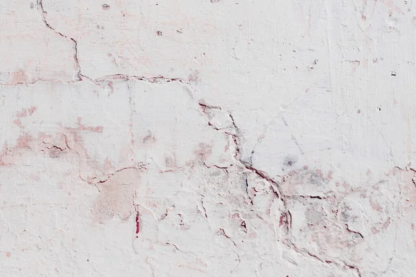 Çatlakları ve çizikleri olan beton bir duvarın dokusu arka plan olarak kullanılabilir.