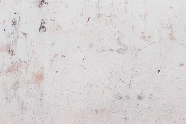 Çatlakları ve çizikleri olan beton bir duvarın dokusu arka plan olarak kullanılabilir.