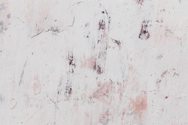 Çatlakları ve çizikleri olan eski beton duvarın dokusu arka plan olarak kullanılabilir.