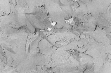 Çatlakları ve çizikleri olan beton bir duvarın dokusu arka plan olarak kullanılabilir.