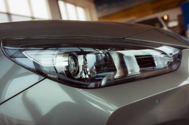 New car in the showroom. Part of the car. Closeup