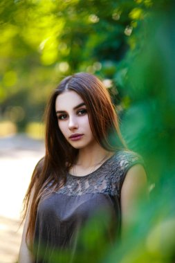 Beautiful girl in central park. Elegant style.