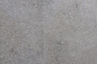 Çatlakları ve çizikleri olan beton bir duvarın dokusu arka plan olarak kullanılabilir.