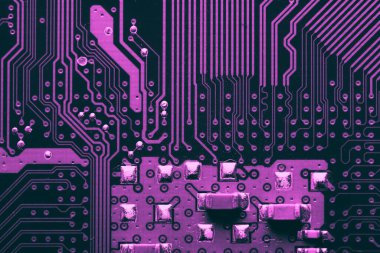 Old desktop motherboard. Chips and electronic components close-up. Can be used as a poster or background for design.