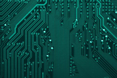 Old desktop motherboard. Chips and electronic components close-up. Can be used as a poster or background for design.
