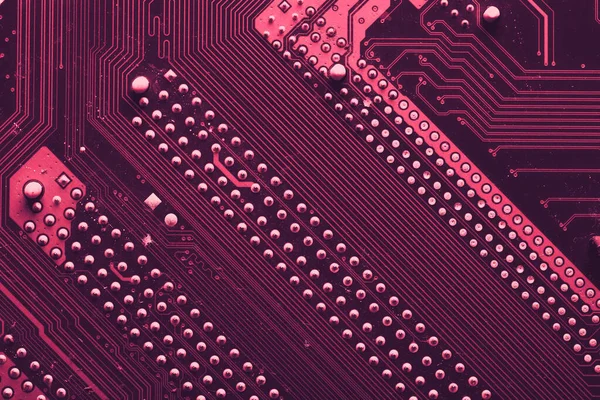 Old desktop motherboard. Chips and electronic components close-up. Can be used as a poster or background for design.