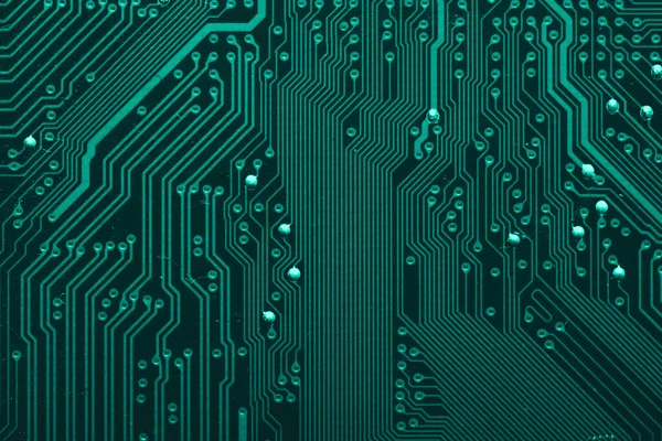 Old desktop motherboard. Chips and electronic components close-up. Can be used as a poster or background for design.
