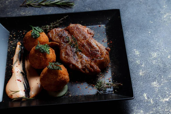 Turkey Steak Caramelized Sauce Potato Balls Black Plate Spices Ground — Foto Stock