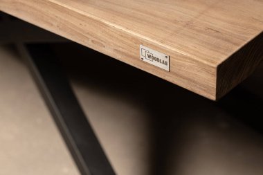 new brown wooden table surface, desk texture with brand logo 