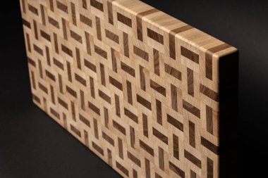 furniture desk, beige color wood surface on black background 