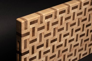 furniture desk, beige color wood surface on black background 