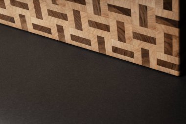 furniture desk, beige color wood surface on black background 