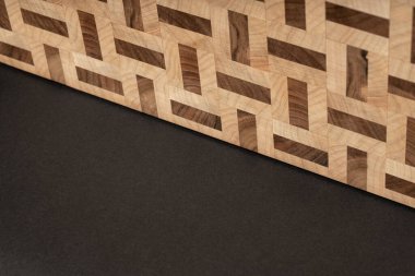 furniture desk, beige color wood surface on black background 