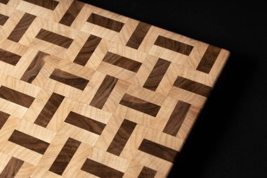 beige color wooden surface on black background 