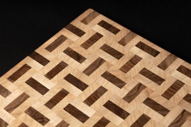 beige color wooden surface on black background 
