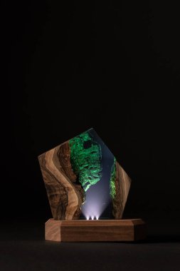 creative epoxy resin table lamp isolated on black background 