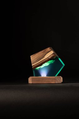 creative epoxy resin table lamp isolated on black background 