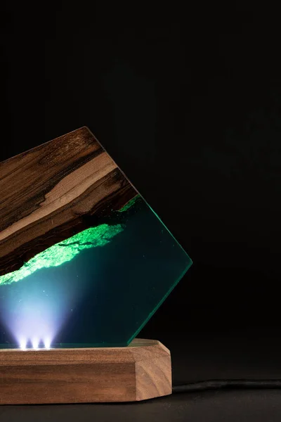 creative epoxy resin table lamp isolated on black background