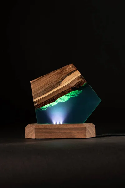 creative epoxy resin table lamp isolated on black background