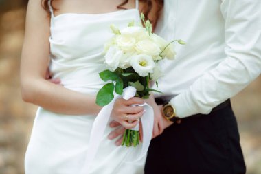 wedding day, bride and groom, woman holding flowers bouquet 
