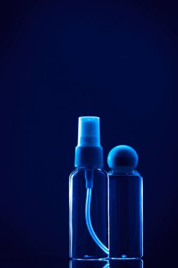 empty plastic bottles on dark blue background 