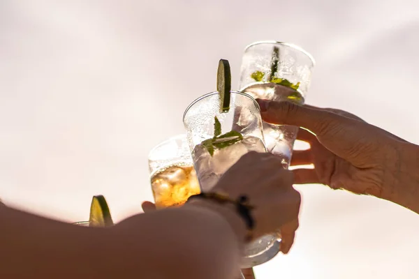 Friends Rising Cocktail Glasses Celebratory Toast Sky Summer — Stock Photo, Image
