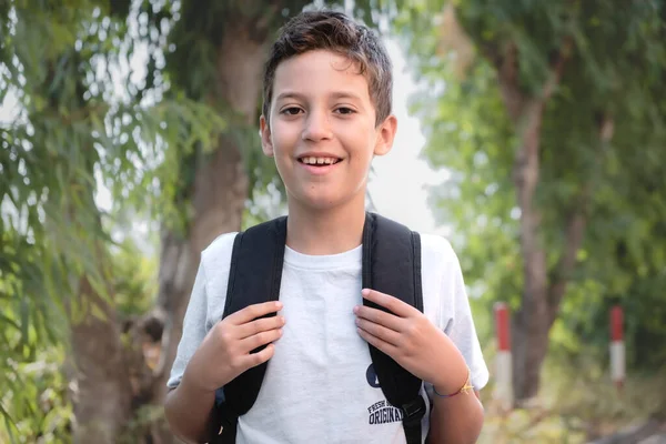 Portrait Boy Walking Trees Backpack Looking Camera — Stock Photo, Image