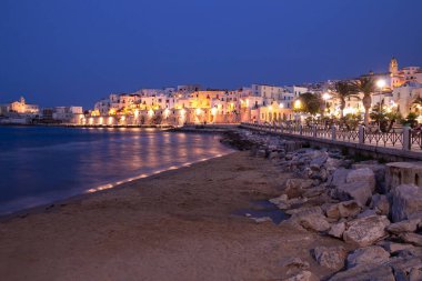 Vieste, Foggia, Italy 29 June 2021 View over historic old town on blue hour at Vieste, Gargano, Apulia, Italy