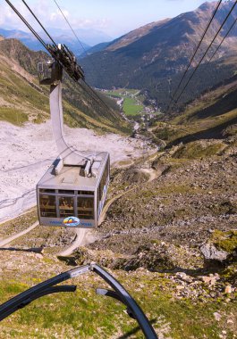 Panoramic view from the mountain station of cableway to Sulden valley (Solda), South Tyrol, Italy; climate change concept;