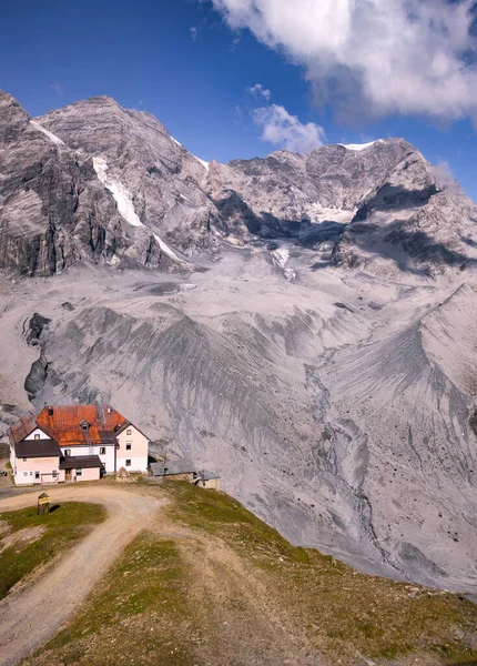 Panoramic view to Peaks Ortles, Zebru and mountain refuge Schaubachhtte (Rifugio Citta di Milano) seen from the top station of cableway at Sulden (Solda), South Tyrol, Italy; climate change concept;