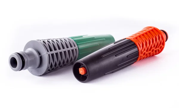 Orange adapter for connection of a garden hose with watering system — Stock Photo, Image