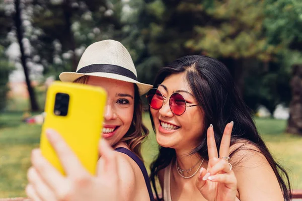 Happy Multiracial Women Gesturing Sign Smiling While Taking Selfie Smartphone — Zdjęcie stockowe