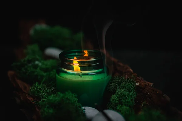 White Lit Candle Glass Jar Flowing Smoke Green Moss Gray — Zdjęcie stockowe