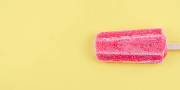 Raspberry Sherbet Wooden Stick Lies Right Yellow Background Copy Space — Φωτογραφία Αρχείου