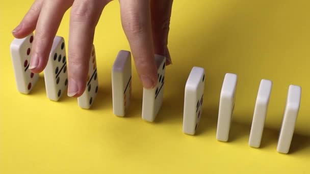Hands Young Caucasian Woman Put Middle Row Dominoes Yellow Background — 비디오