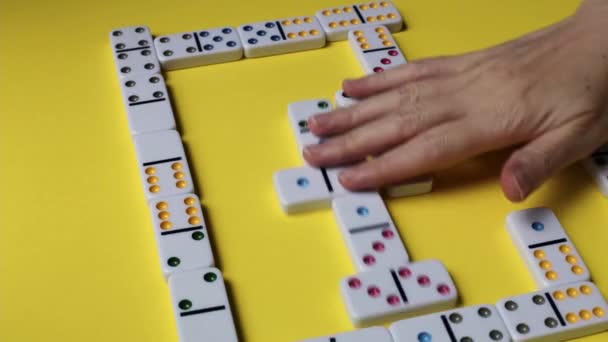 Hands Young Caucasian Woman Mixing Zigzag Dominoes Finishing Game Yellow — стоковое видео