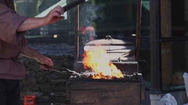 Middle Aged Caucasian Male Blacksmith Medieval Era Forges Iron Fanning — Stok video