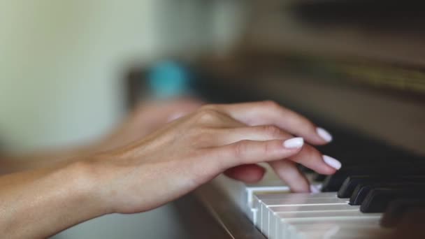 Hand Young Caucasian Woman Delicate White Manicure Fingering Keys Playing — Stockvideo
