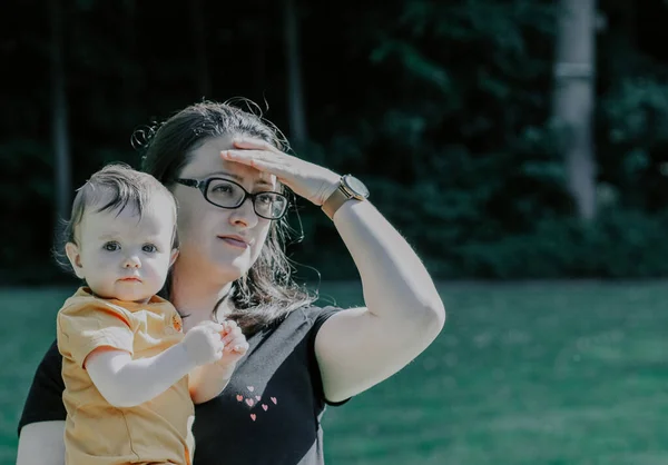 Beautiful Caucasian Baby Girl Arms Young Mother Looking Distance Other — Fotografia de Stock