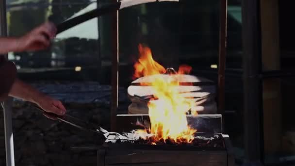 Middle Aged Caucasian Male Blacksmith Medieval Era Forges Iron Fanning — Vídeo de Stock