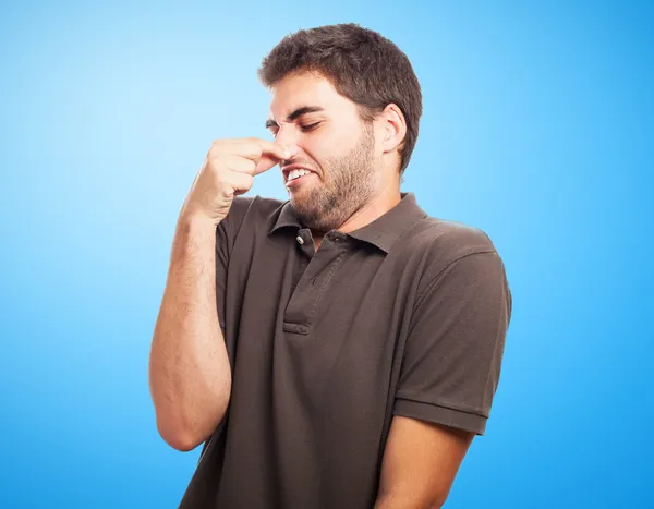 Young man smelling — Stock Photo, Image