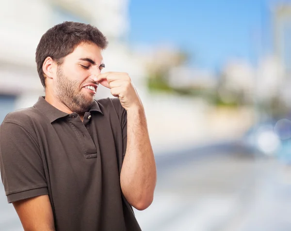 Young man smelling — Stock Photo, Image